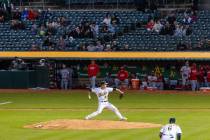 The Oakland Athletics starting pitcher Drew Rucinski delivers against the Cincinnati Reds, on F ...