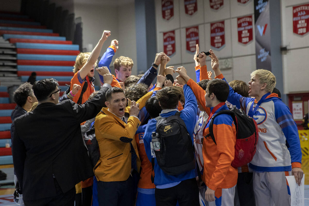 Bishop Gorman celebrates winning the state championship Class 4A championship wrestling meet at ...