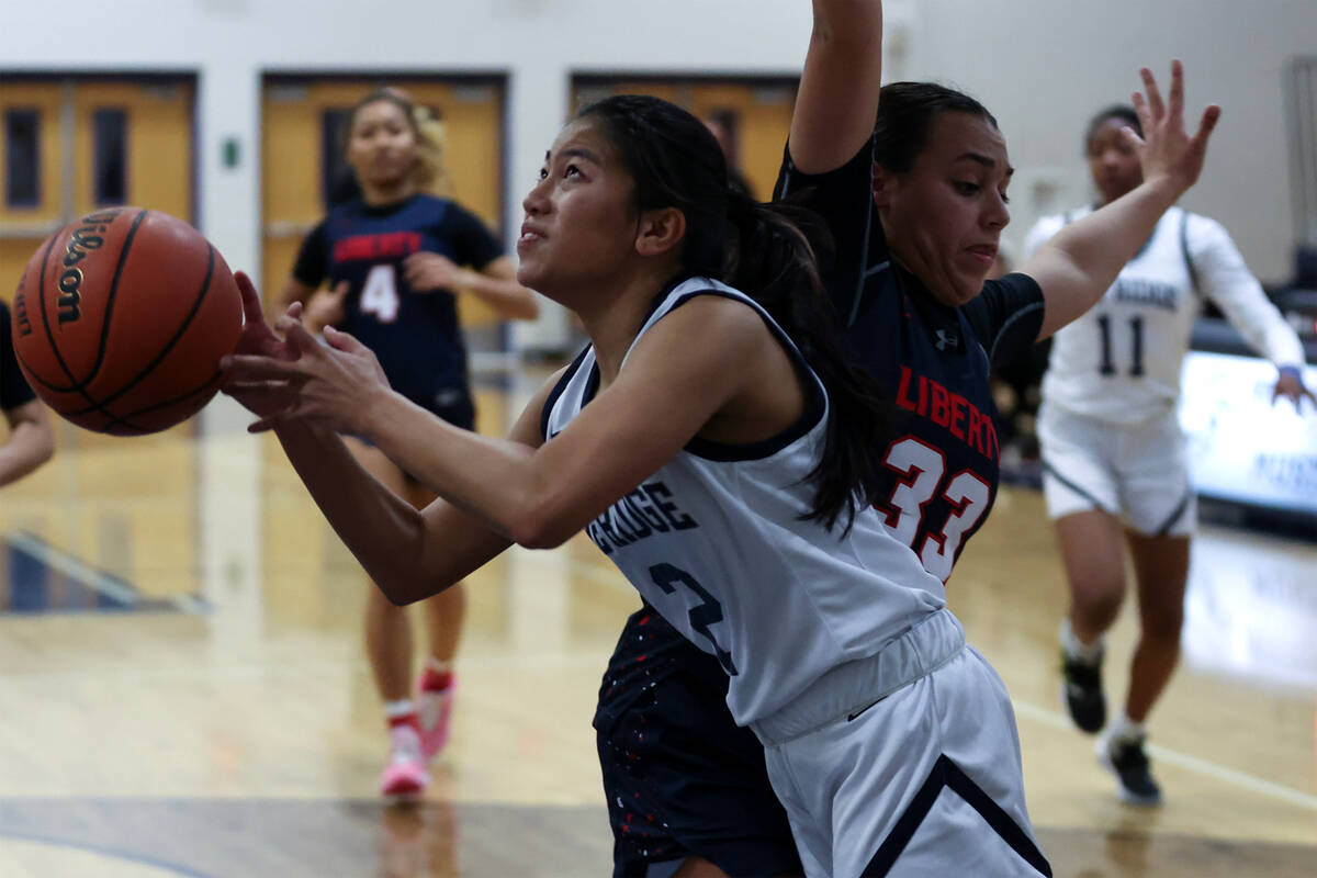 Shadow Ridge guard Jasmine Mata (2) shoots against Liberty's Leiliani Harworth (33) during the ...