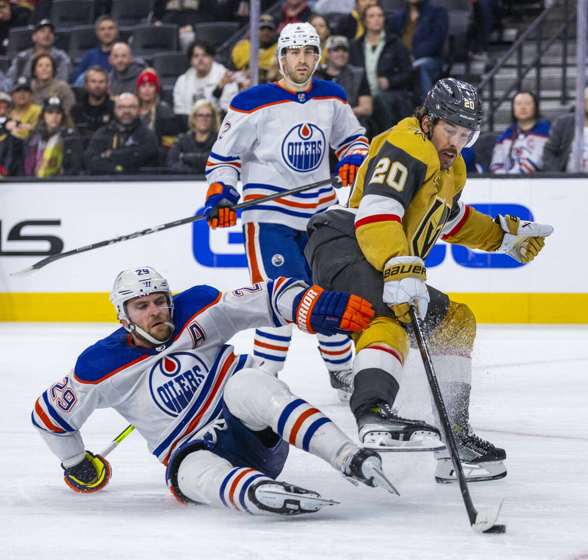 Edmonton Oilers center Leon Draisaitl (29) takes out Golden Knights center Chandler Stephenson ...