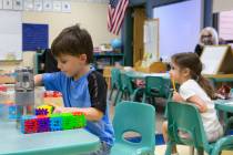 Marcus Jimmerson, center, 5, plays with building blocks at Camp Mustang at The Meadows School o ...