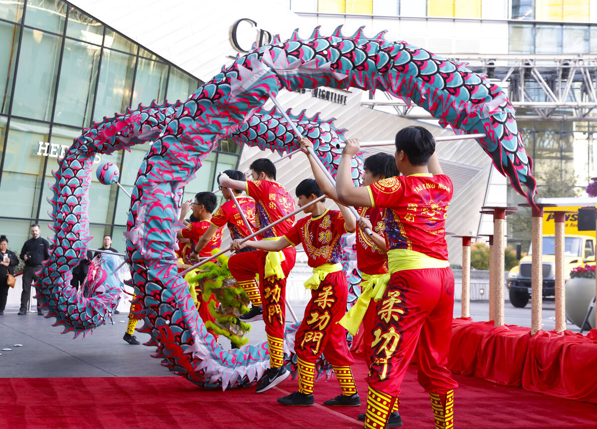 Members of Yau Kung Moon perform the Chinese Dragon and Lion dance to commemorate Lunar New Yea ...