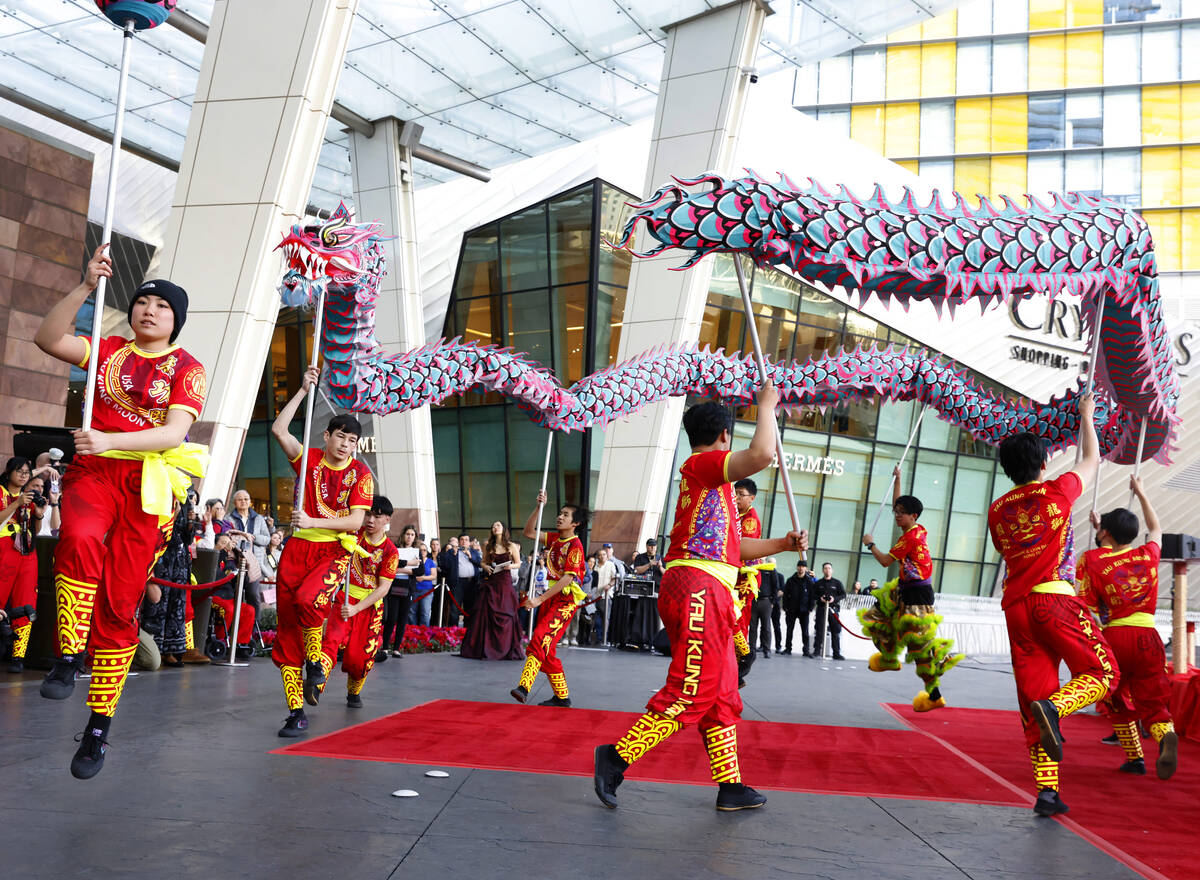 Members of Yau Kung Moon perform the Chinese Dragon and Lion dance to commemorate Lunar New Yea ...