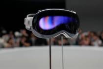 The Apple Vision Pro headset is displayed in a showroom on the Apple campus in Cupertino, Calif ...