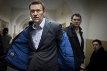 FILE - Russian opposition leader Alexei Navalny prepares to speak to journalists outside a cour ...