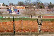 A National Guard soldier guards Shelby Park in Eagle Pass, Texas on Sunday, Feb. 4, 2024. (Jay ...
