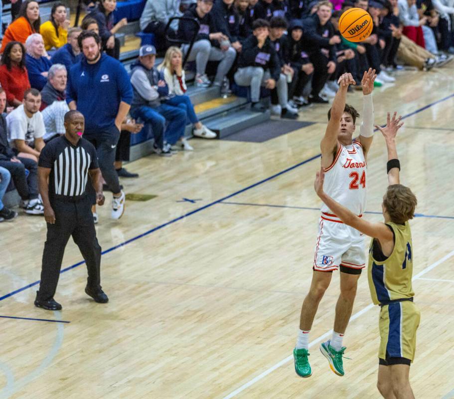 Bishop Gorman's Ryder Elisaldez (24) gets off a shot over Foothill's Christopher Natale Jr. (14 ...