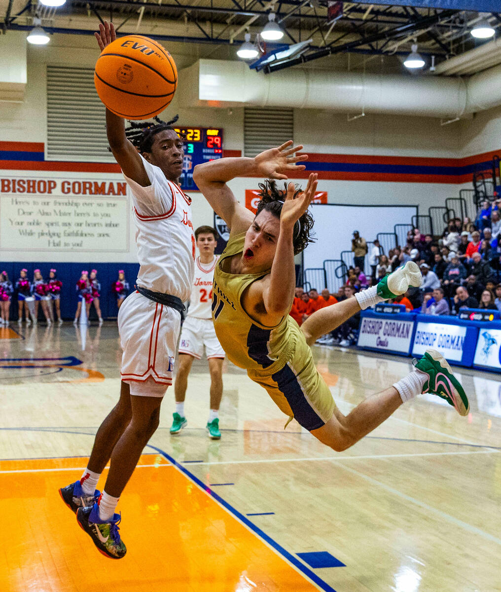 Bishop Gorman's Nick Jefferson (10) fouls Foothill's Zak Abdalla (11) hard as he drives the lan ...