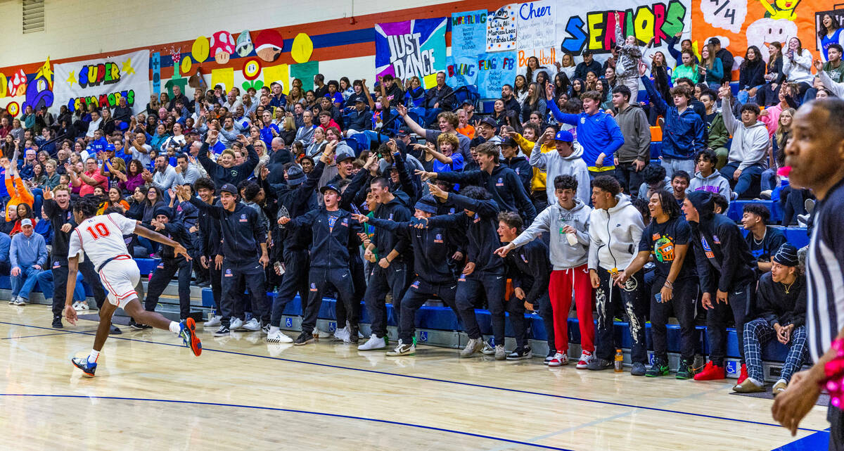 Bishop Gorman's Nick Jefferson (10) is celebrated by the crowd after a three-point basket over ...