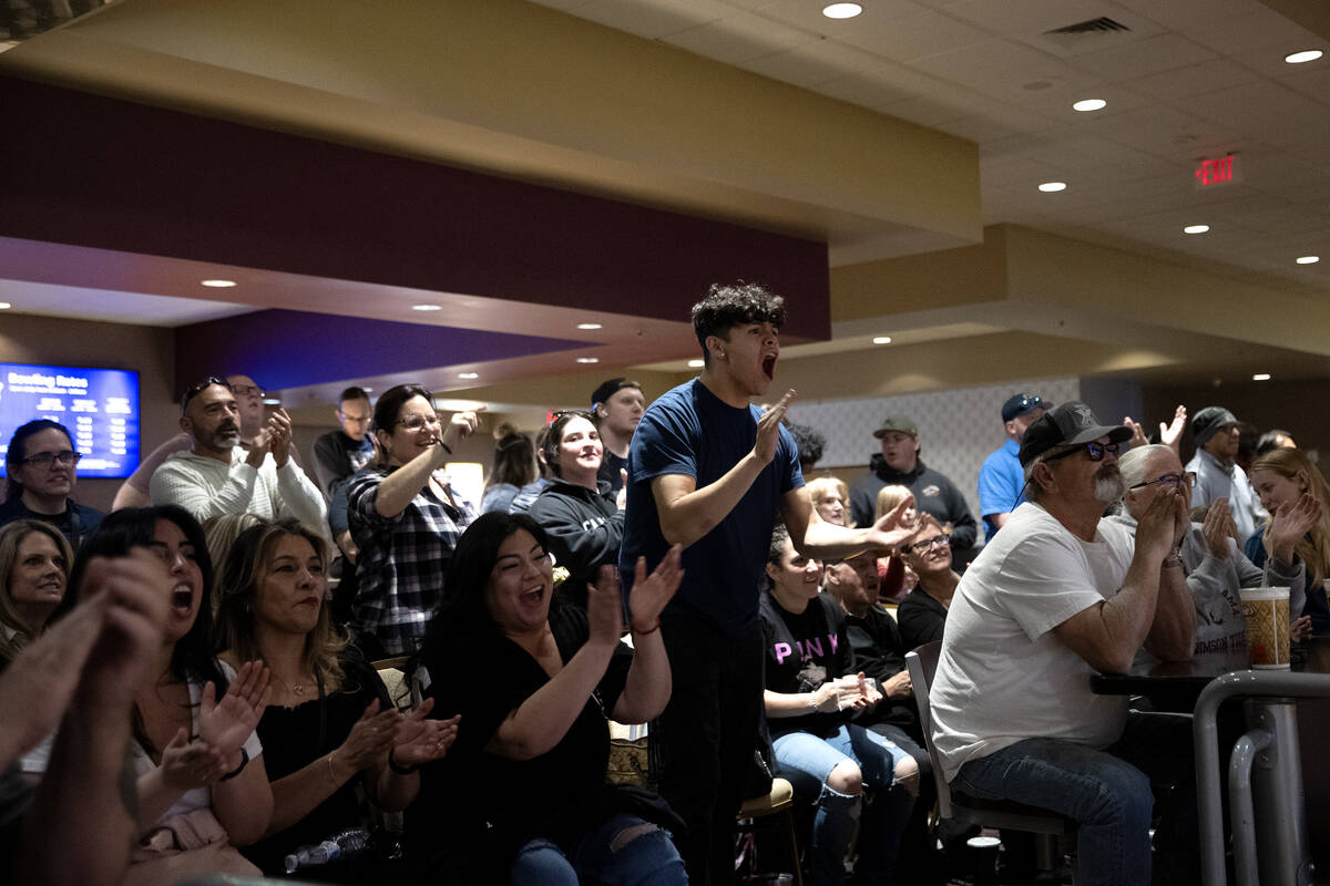Fans cheer for their teams during high school state bowling championships at The Orleans on Fri ...