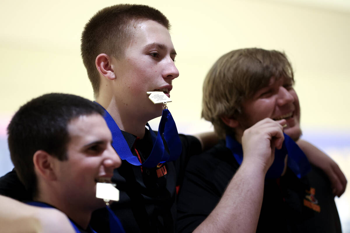 SECTA’s Tavino Perez, left, Casey McKracken and Terry Hardy pose with their medals after ...