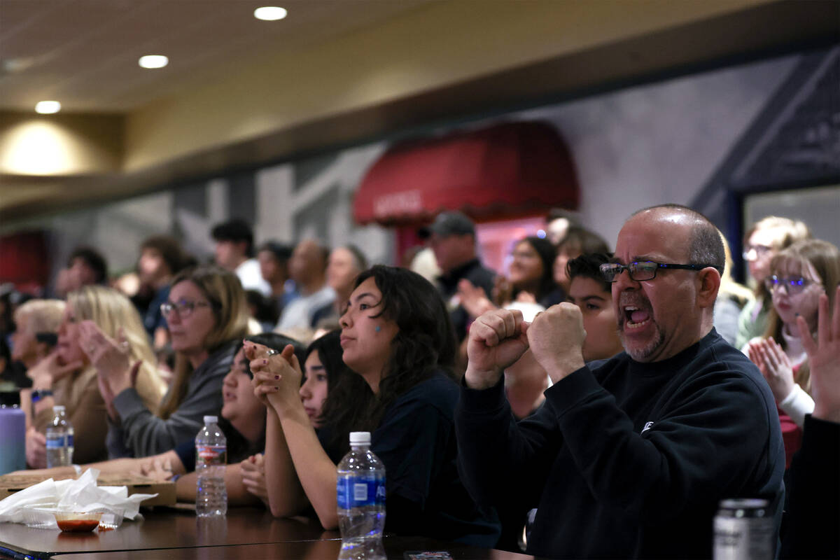 Fans cheer for their teams during the NIAA high school state bowling championships at The Orlea ...
