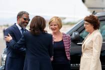 Vice President Kamala Harris is greeted by Rep. Steven Horsford, D-Nev., left, Rep. Susie Lee, ...