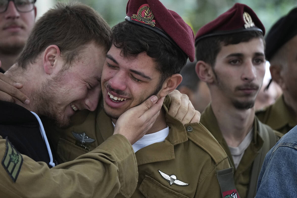 Mourners weep for Israeli Defense Forces Sgt. Rotem Sahar Hadar, a Paratrooper who was killed i ...