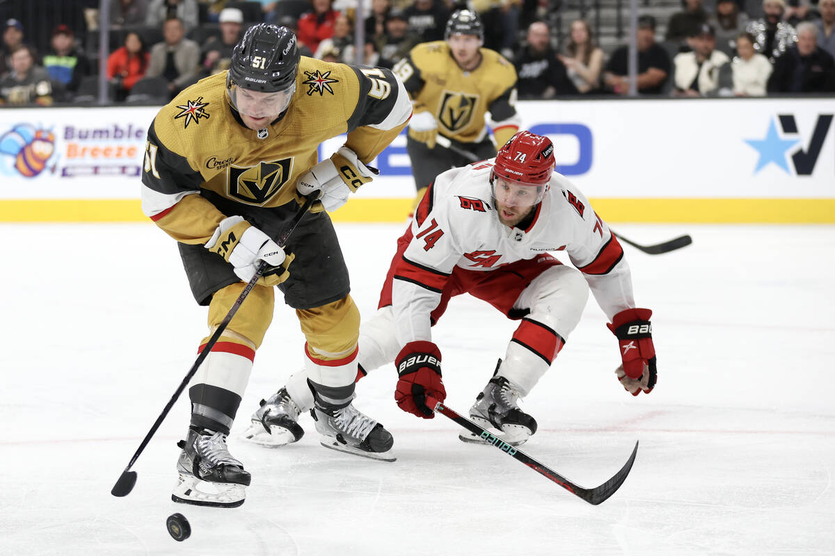 Golden Knights center Byron Froese (51) skates with the puck against Hurricanes defenseman Jacc ...