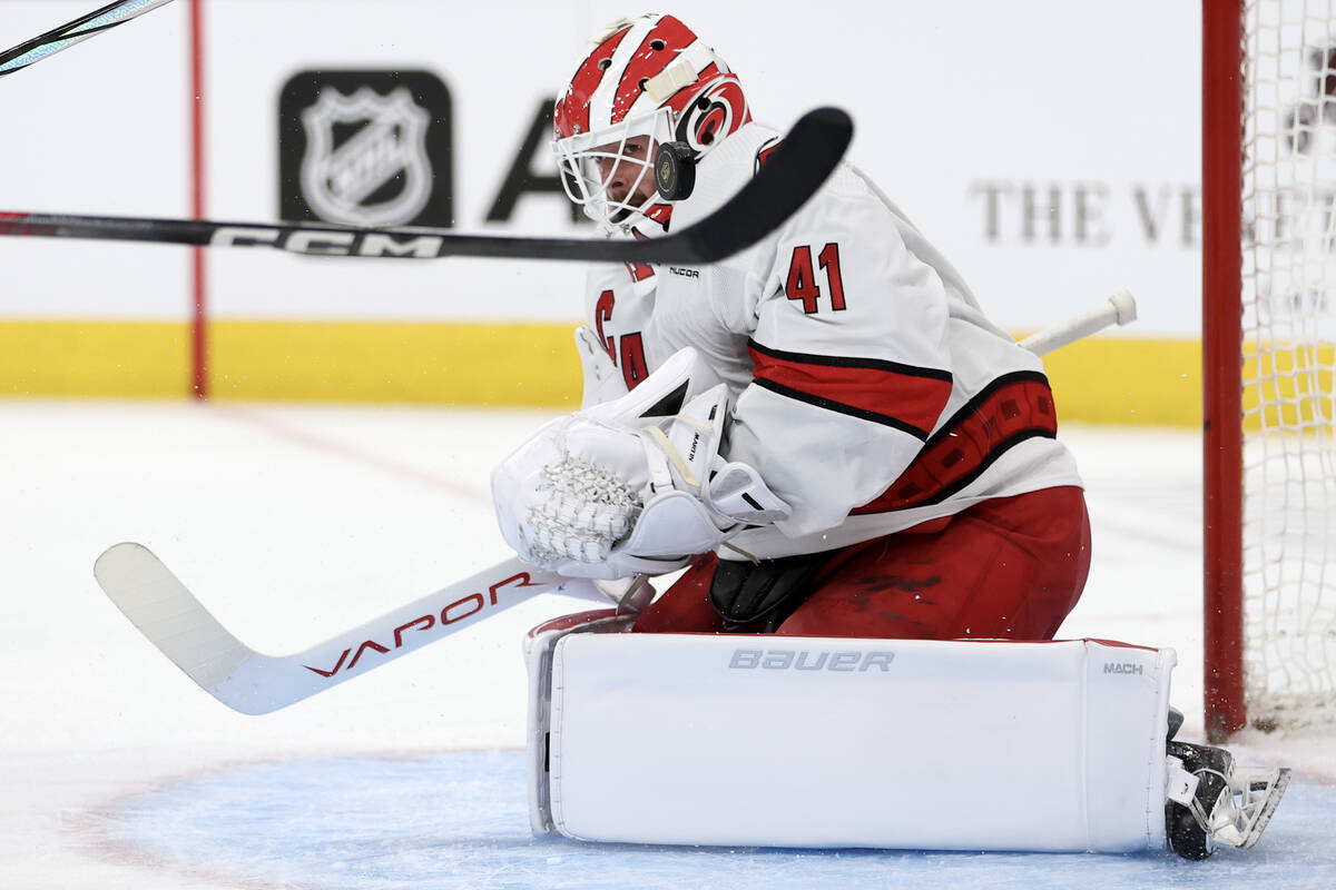 Hurricanes goaltender Spencer Martin (41) saves the puck during the first period of an NHL hock ...