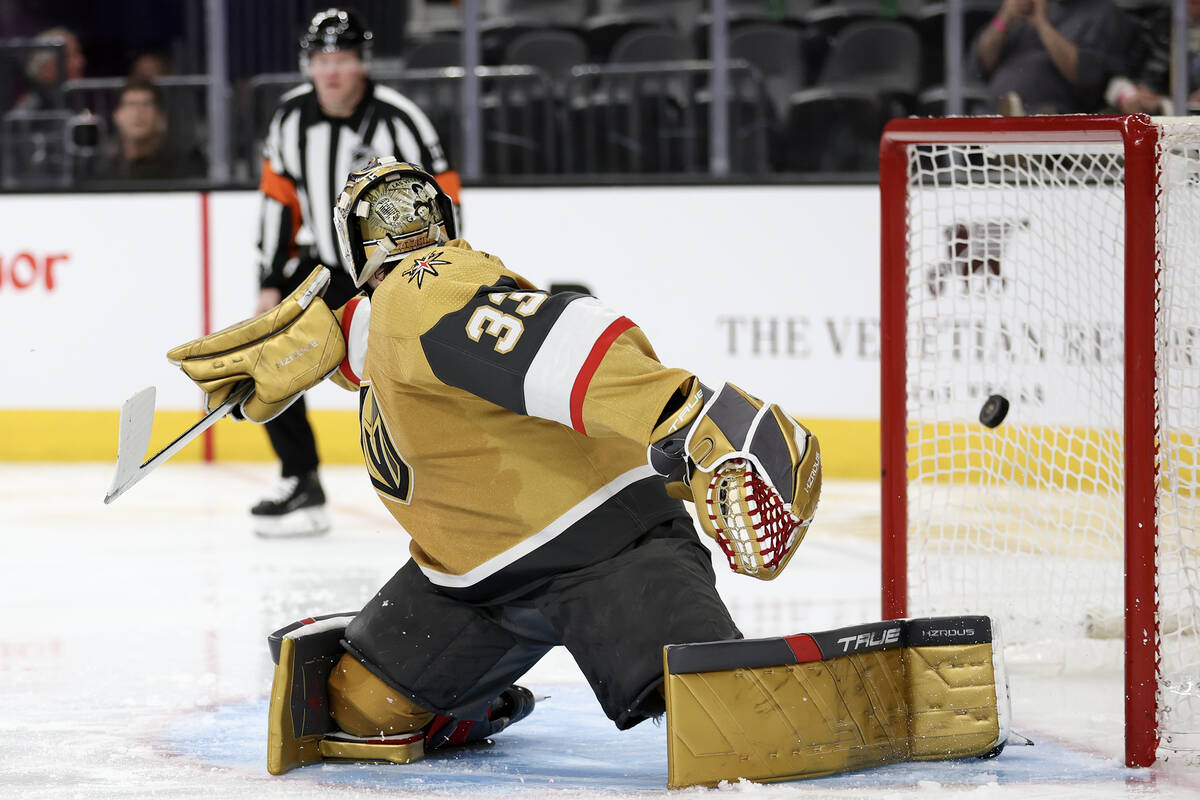 Golden Knights goaltender Adin Hill (33) misses the save on a goal by the Hurricanes during the ...