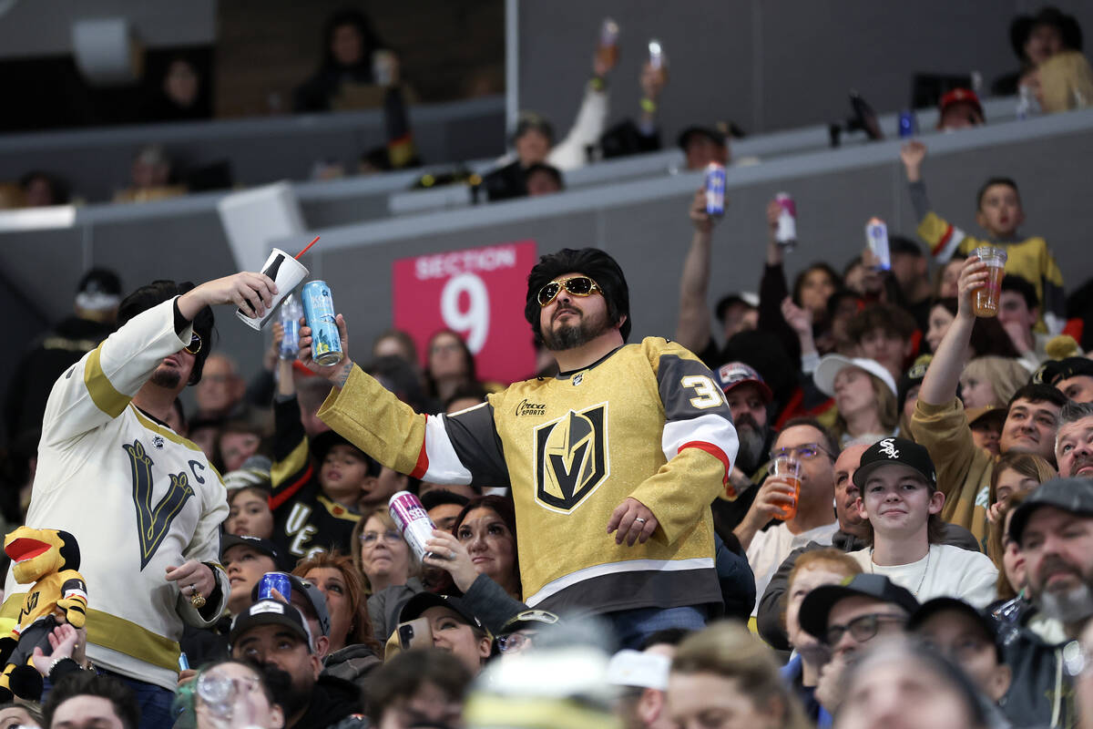 Golden Knights fans raise their glasses for the “cheers cam” during the second pe ...