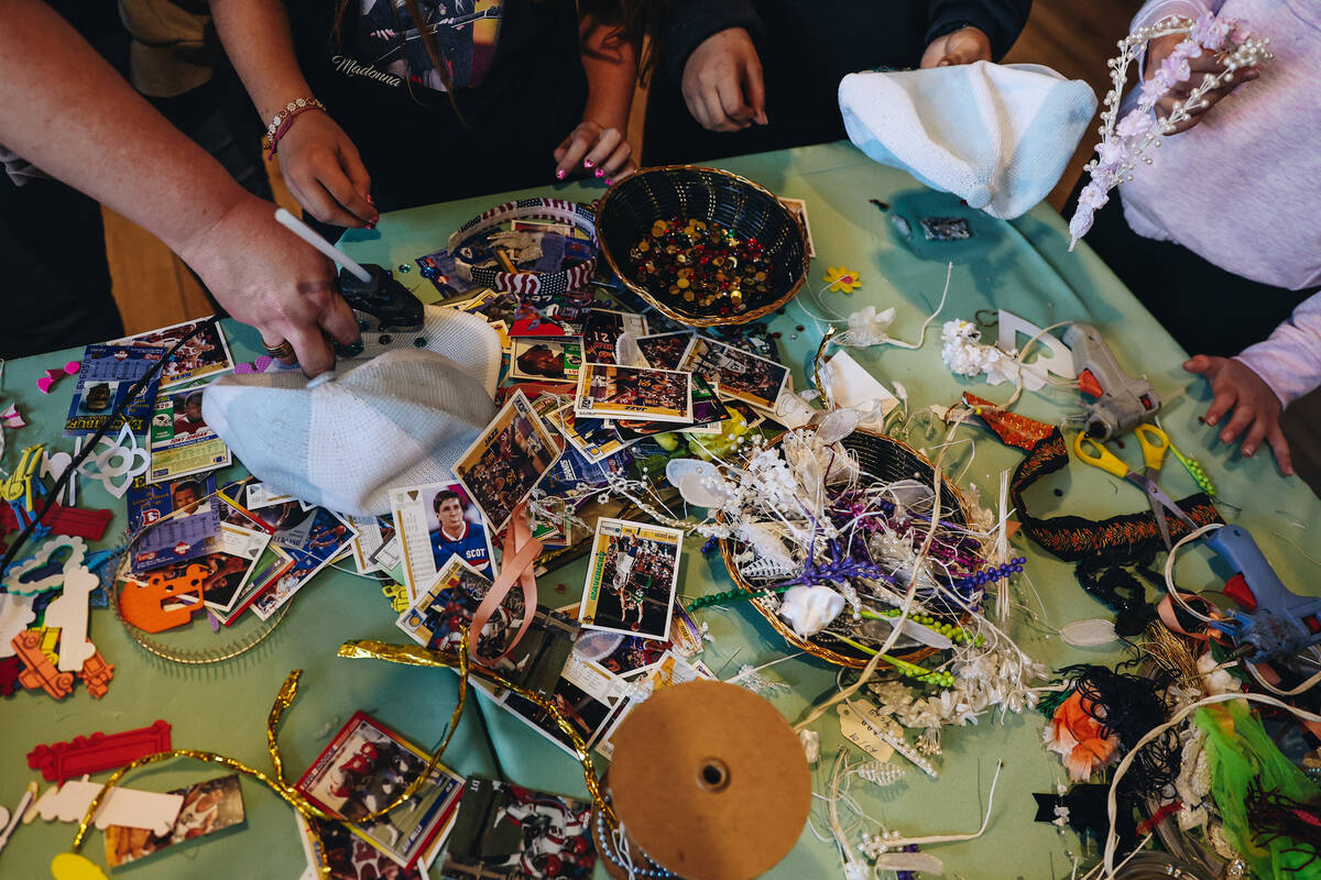 Attendees make hats at a craft table at the Springs Preserve’s 15th annual Black History ...