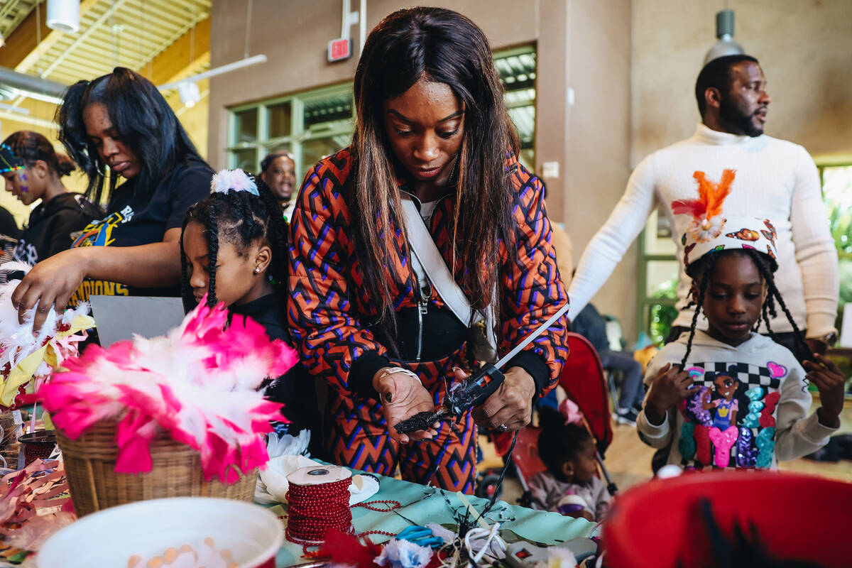 Attendees make hats at a craft table at the Springs Preserve’s 15th annual Black History ...