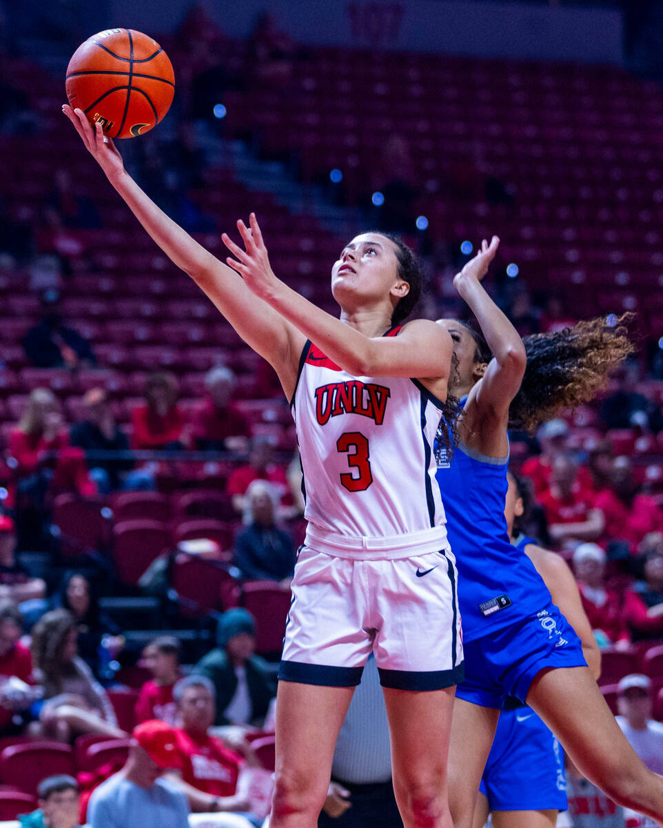 UNLV Lady Rebels guard Kiara Jackson (3) rolls off a shot with Air Force Falcons guard Milahnie ...