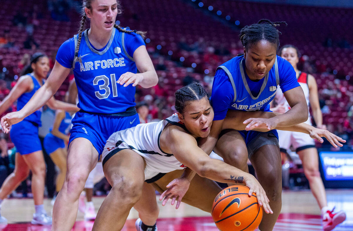 UNLV Lady Rebels forward Nneka Obiazor (1) and Air Force Falcons guard Taylor Britt (5) battle ...