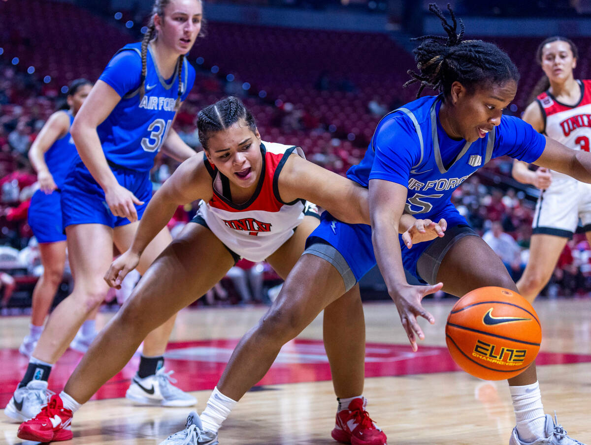 UNLV Lady Rebels forward Nneka Obiazor (1) and Air Force Falcons guard Taylor Britt (5) battle ...