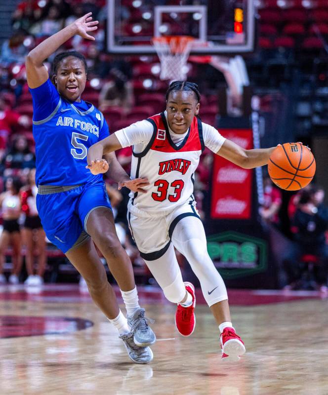 UNLV Lady Rebels guard Amarachi Kimpson (33) drives the court against Air Force Falcons guard T ...