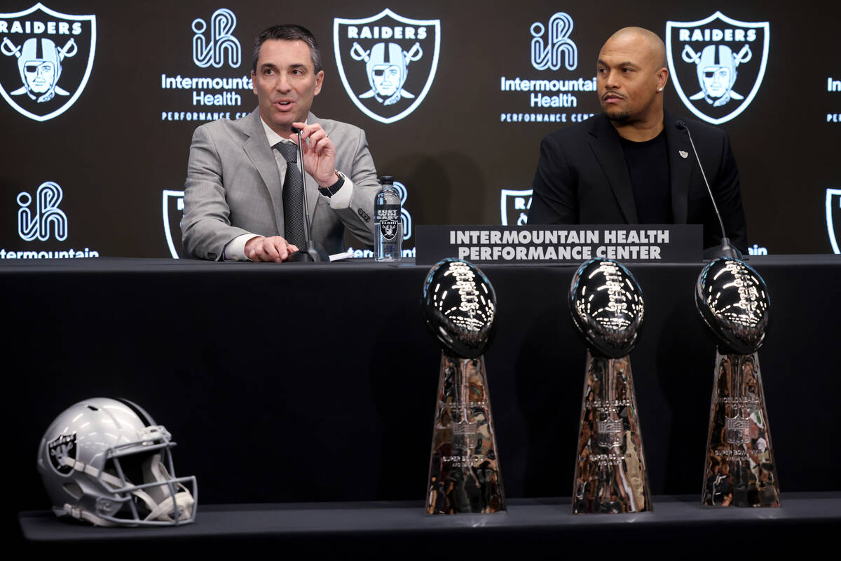 Tom Telesco, left, and Antonio Pierce are introduced as general manager and coach during a pres ...