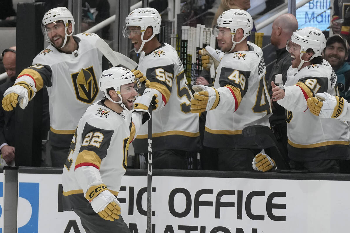 Vegas Golden Knights right wing Michael Amadio (22) is congratulated by teammates after scoring ...