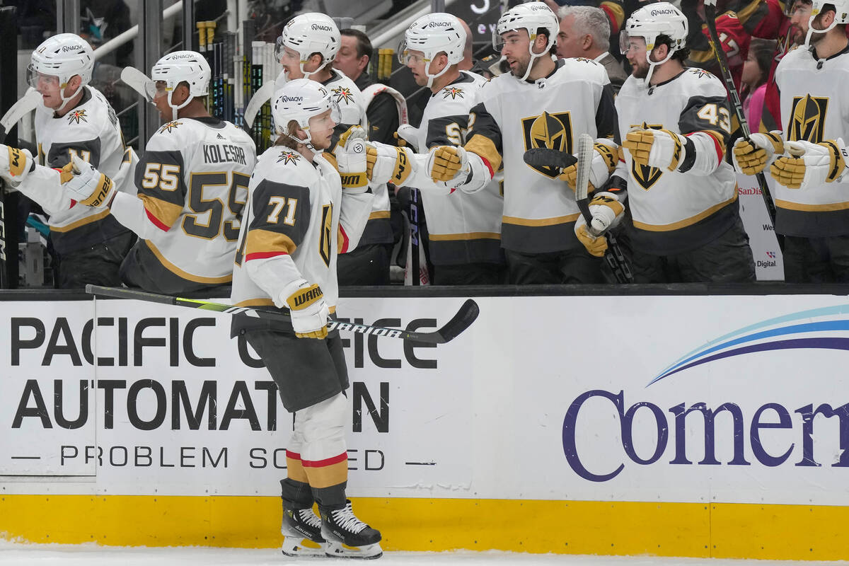 Vegas Golden Knights center William Karlsson (71) is congratulated by teammates after scoring a ...