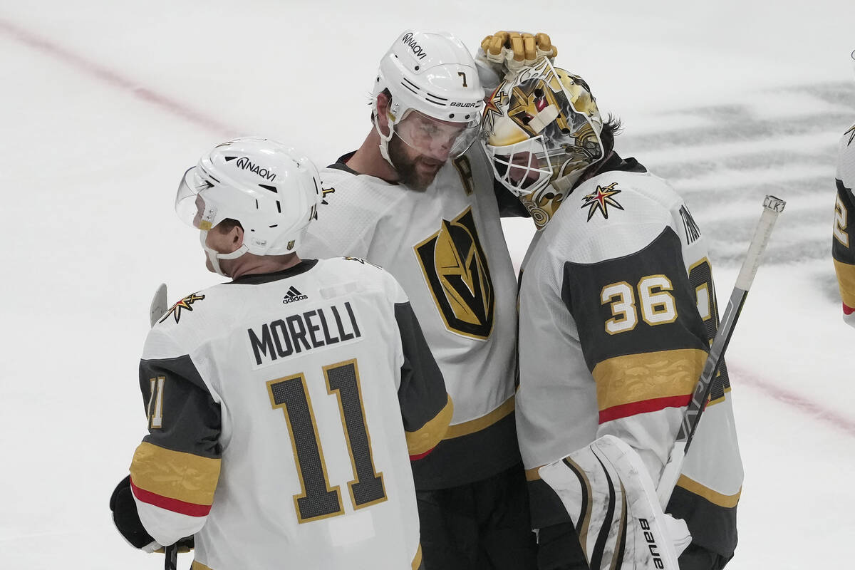 Vegas Golden Knights goaltender Logan Thompson (36) celebrates with defenseman Alex Pietrangelo ...