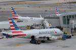 American Airlines raises bag fees, changes how customers earn frequent-flyer points