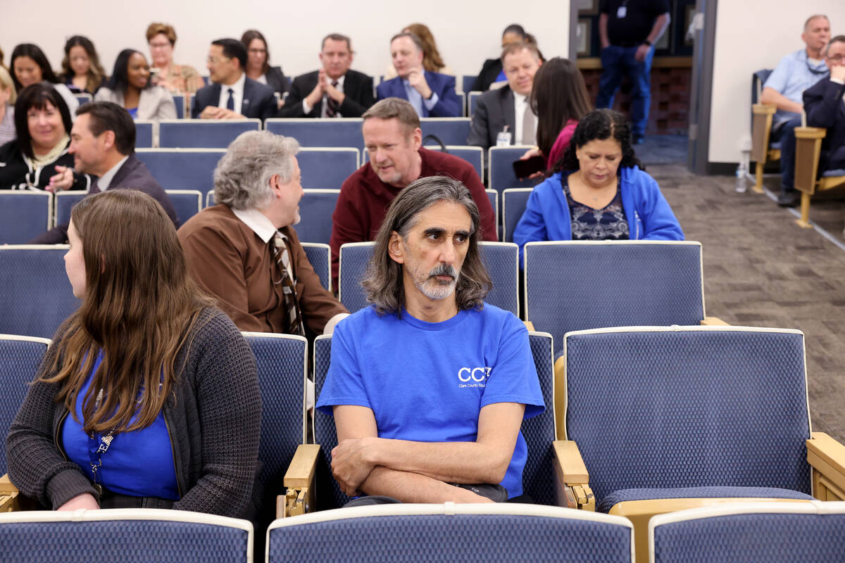 Audience members, including Aramis Bacallao, an English language arts teacher at Becker Middle ...