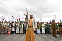 FILE - Houthi supporters attend a rally against the U.S.-led airstrikes on Yemen and in support ...