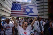 Pro-Israel demonstrators attend a rally denouncing antisemitism and antisemitic attacks, in low ...