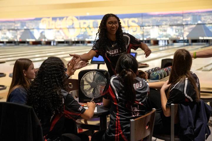 Desert Oasis’ Shantell Hunt slaps hands with her team after a strike during the Class 5A ...