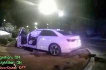 A screen grab of police body camera footage showing officer Katherine Cochran's white Audi, whi ...