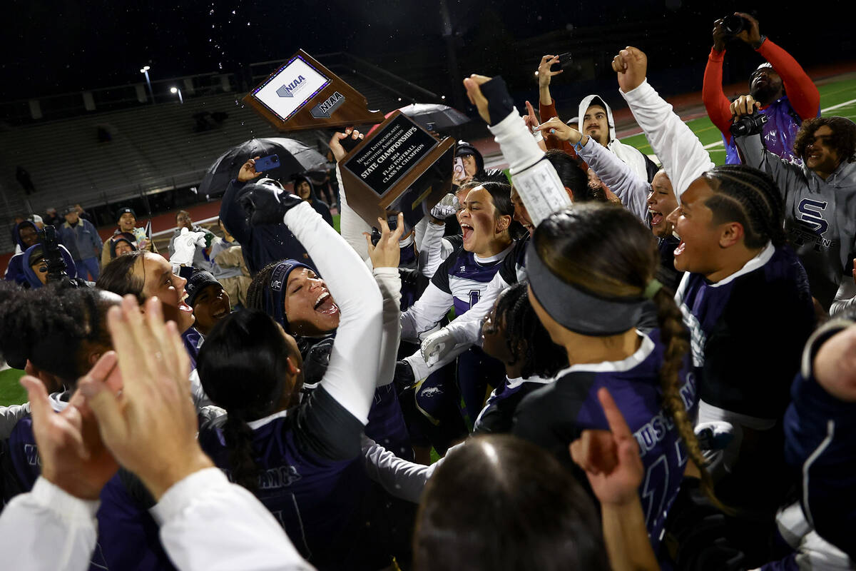 Shadow Ridge celebrates after winning the Class 5A flag football state championship game agains ...