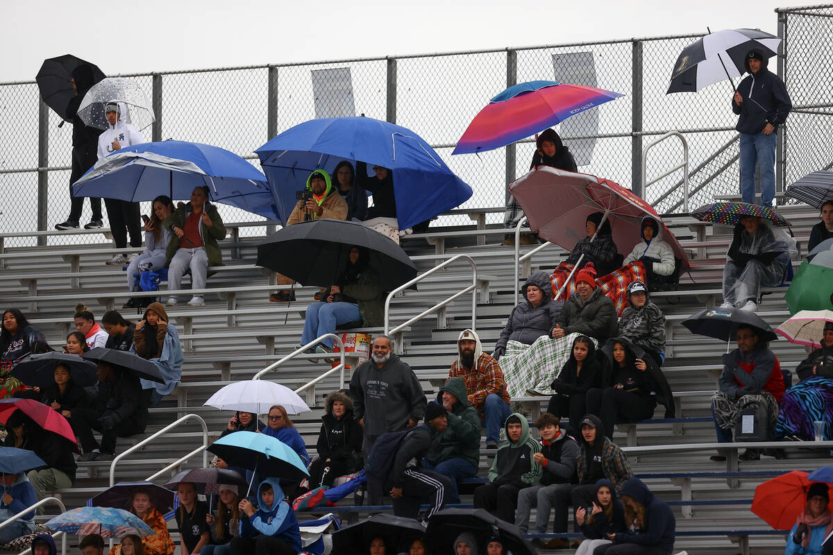 Shadow Ridge fans show up for their team despite the rain during the first half of a Class 5A f ...