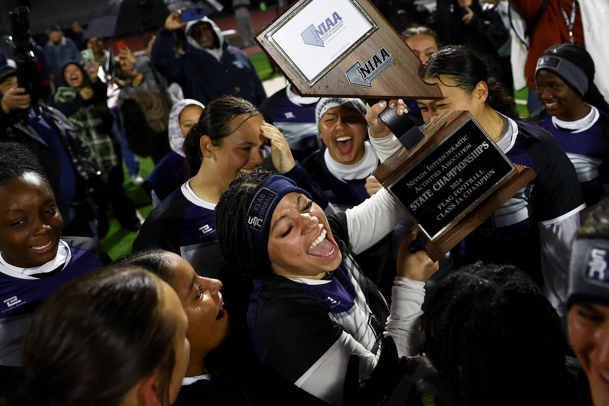 Shadow Ridge celebrates with their trophy after winning the Class 5A flag football state champi ...