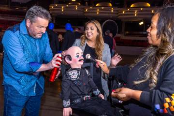 Terry Fator helps to make up his puppet Walter T. Airdale with Rosa Armas and Kiera Bright with ...