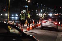 LAPD police check drivers at a DUI checkpoint in Reseda, Los Angeles, on April 13, 2018. (Mark ...