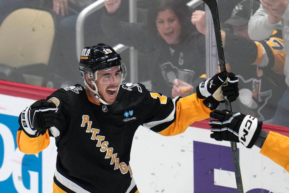 Pittsburgh Penguins' Reilly Smith, left, celebrates after scoring his second goal of the first ...