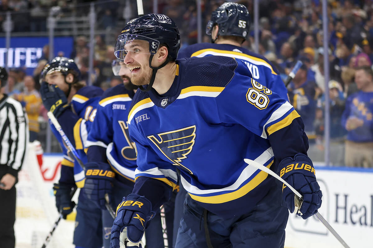 St. Louis Blues' Pavel Buchnevich (89) smiles as he skates towards the team's bench after scori ...