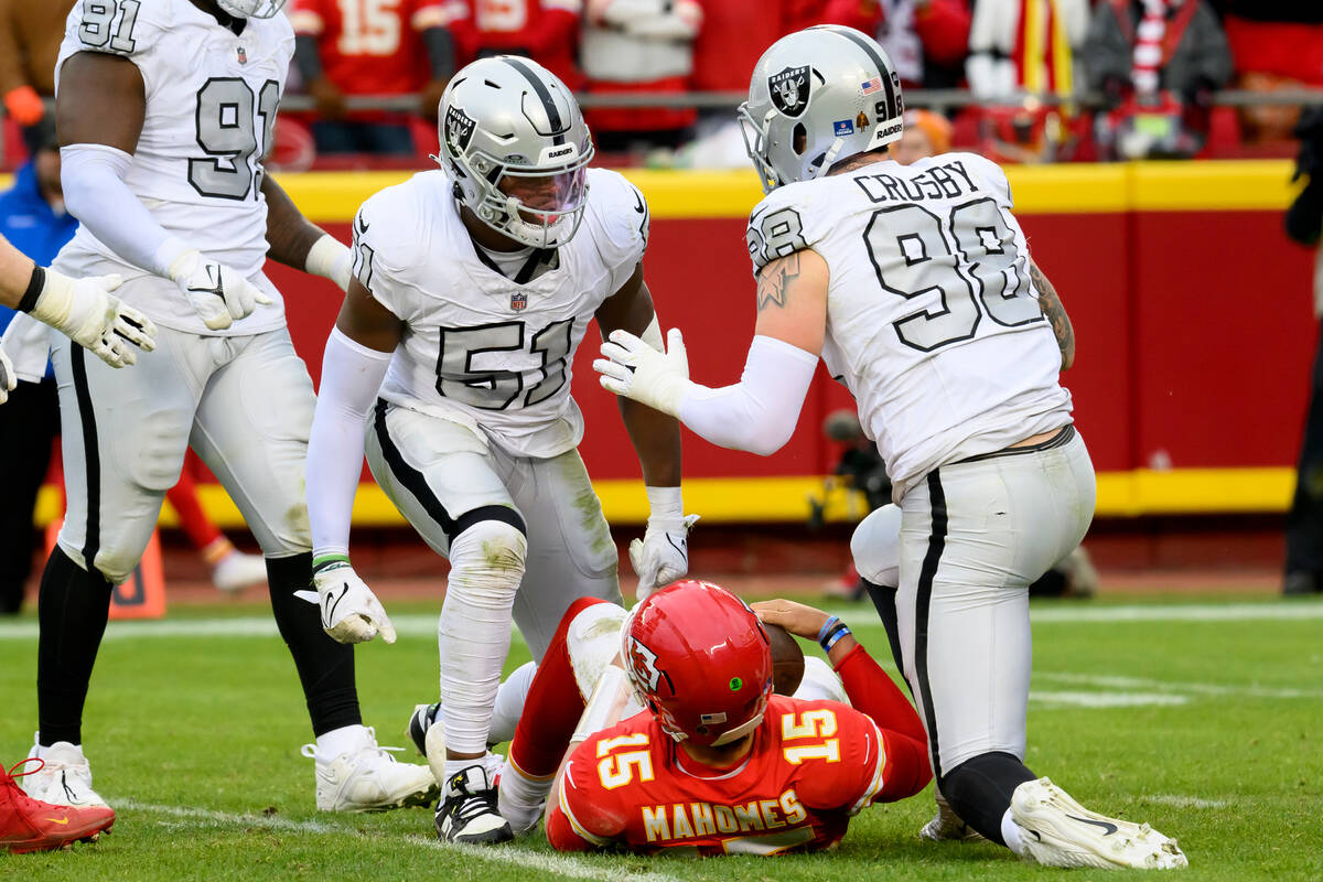 Las Vegas Raiders defensive end Malcolm Koonce (51) celebrates with Raiders defensive end Maxx ...