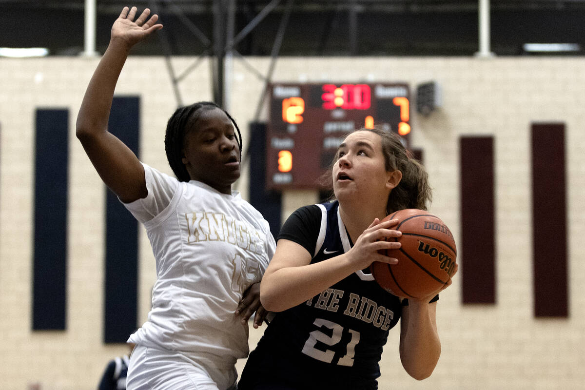 Shadow Ridge’s Lily-Renee Roopchand (21) shoots against Democracy Prep’s Zhanea B ...