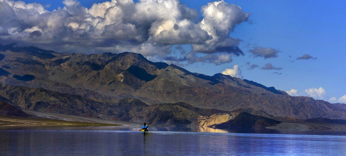 Ashley Lee, president of the Amargosa Conservancy, kayaks on the temporary Lake Manly at Badwa ...