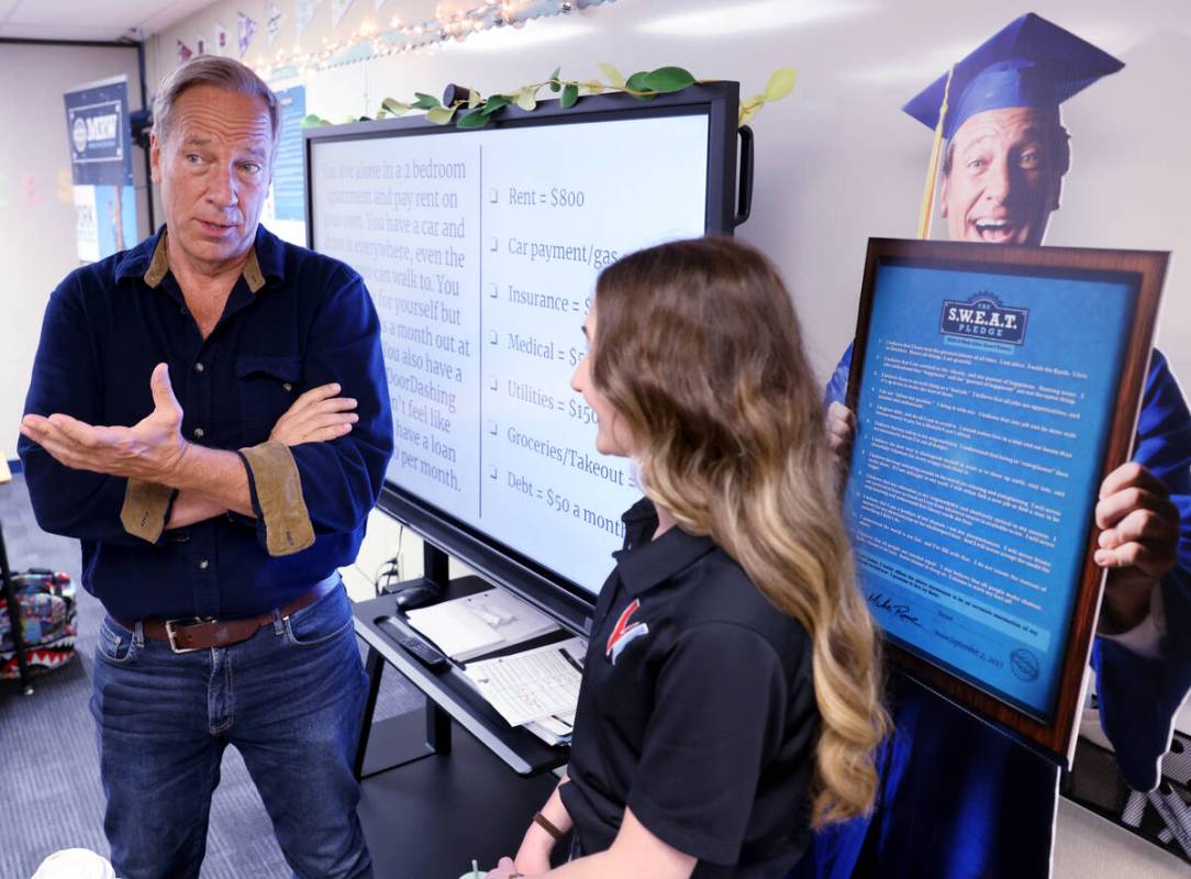 Mike Rowe of “Dirty Jobs” visits with Freshman Studies teacher Liz Dringoli whil ...