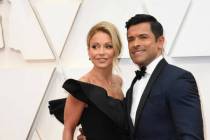 Kelly Ripa, left, and Mark Consuelos arrive at the Oscars on Sunday, Feb. 9, 2020, at the Dolby ...